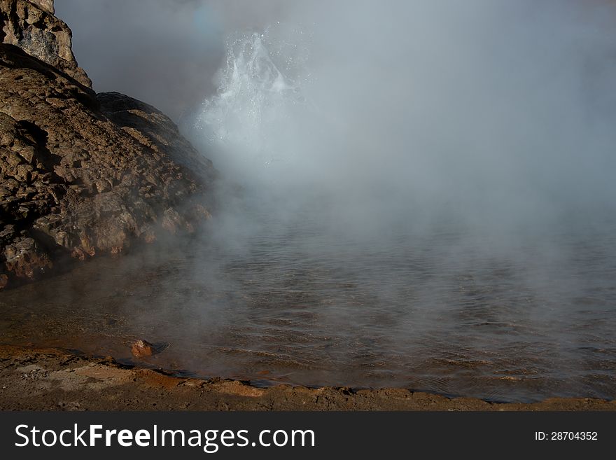A geyser erupting at Tatio Geysers. A geyser erupting at Tatio Geysers