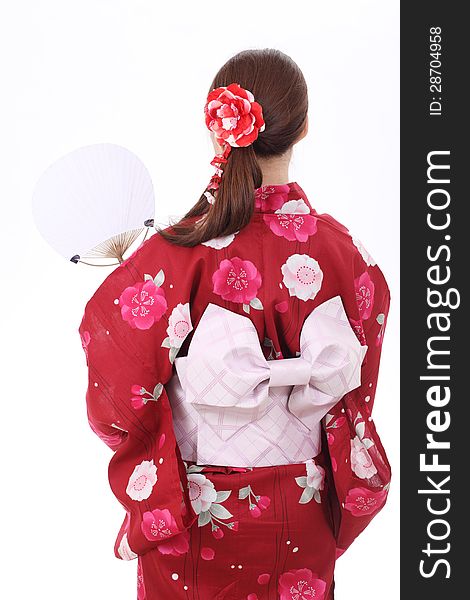 Rear view of asian woman in traditional clothes of kimono with paper fan. Rear view of asian woman in traditional clothes of kimono with paper fan