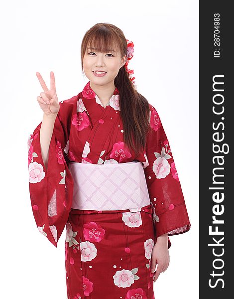 Young asian woman in traditional clothes of kimono with peace sign. Young asian woman in traditional clothes of kimono with peace sign