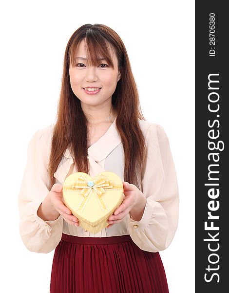 Young asian woman holding a gift box on white background
