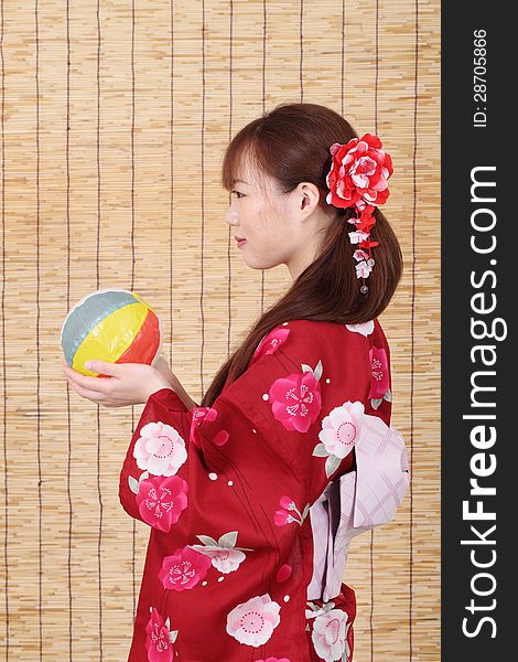 Profile of young asian woman in traditional clothes of kimono with paper balloon