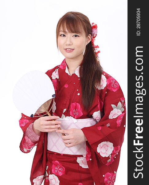 Young asian woman in traditional clothes of kimono with paper fan. Young asian woman in traditional clothes of kimono with paper fan