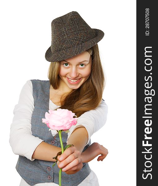 Smiling teen girl in hat giving a rose. Isolated on white. Smiling teen girl in hat giving a rose. Isolated on white