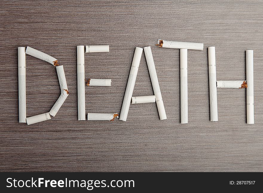 Concept of the dangers of smoking. the word death of cigarettes. Concept of the dangers of smoking. the word death of cigarettes