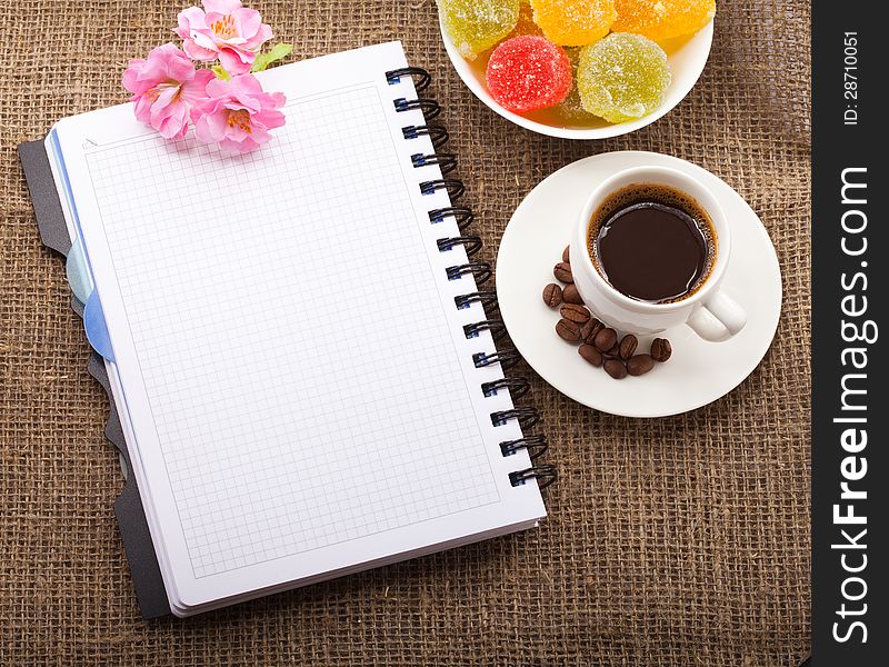 Cup Of Coffee, Grains On Burlap Background