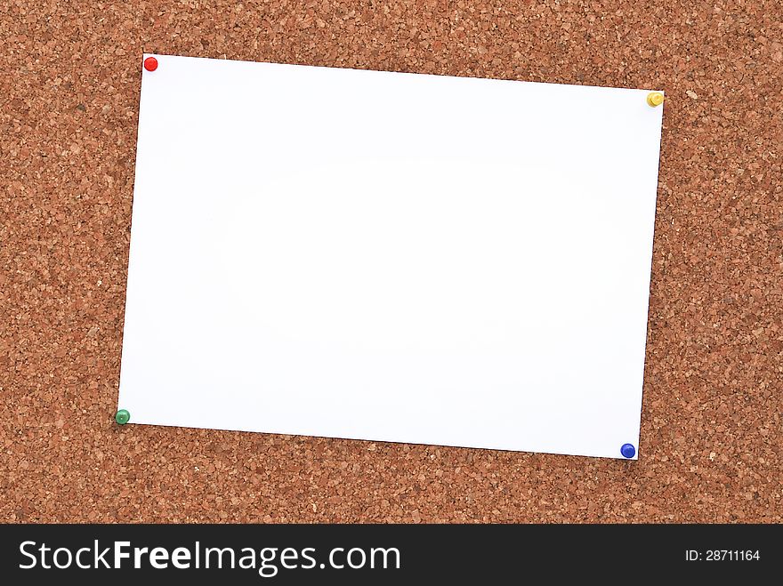 Cork board with paper attached to it. Cork board with paper attached to it.