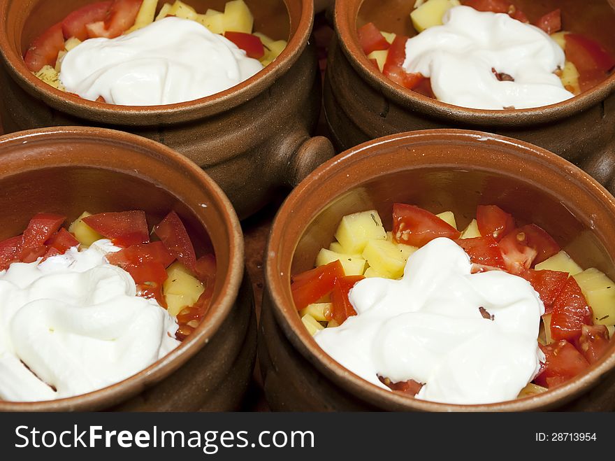Vegetables for cooking with sour cream in clay pots