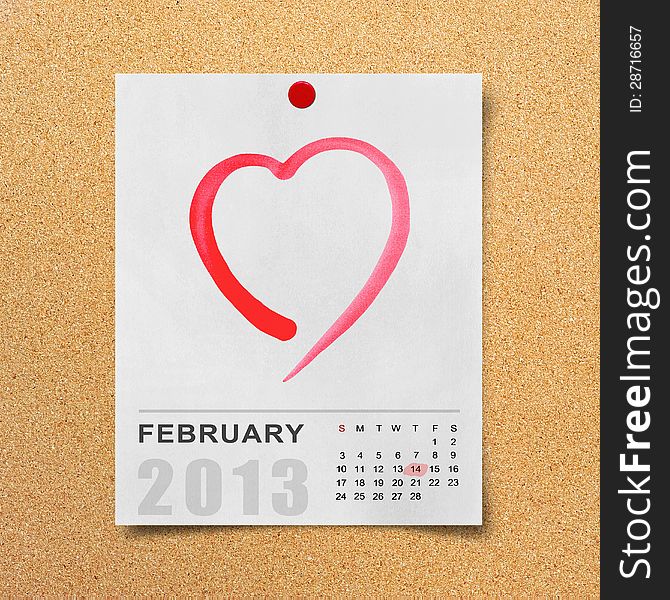Calendar 2013 and red heart on note paper.