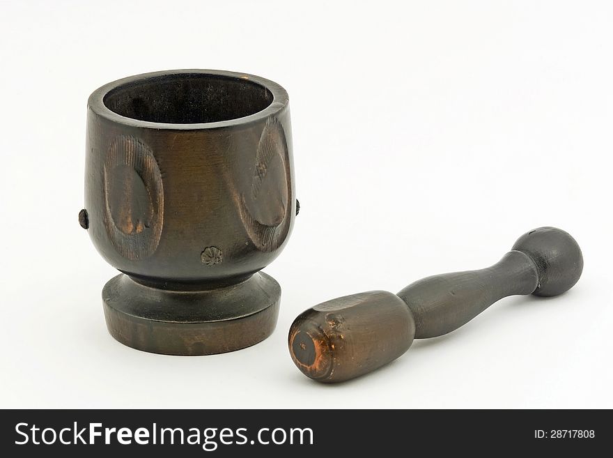 Mortar in dark wood inlayed with its pestle. Mortar in dark wood inlayed with its pestle