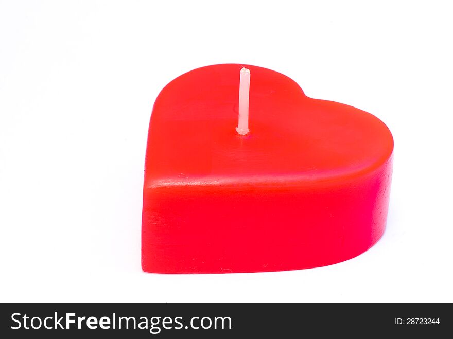 Candle of love on a white background.
