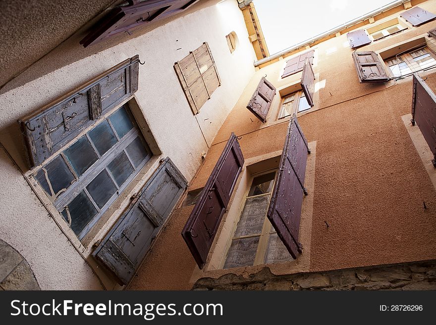 Plastered Wall With Shutterd Windows