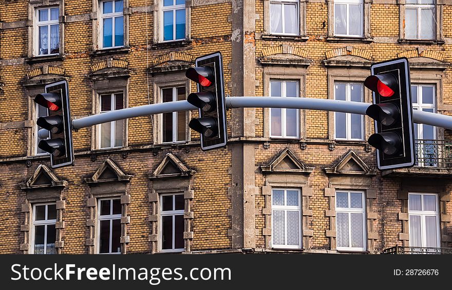 Traffic lights on the background of an old tenement in Bytom, Silesia region, Poland.