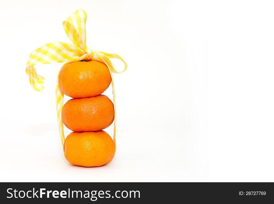 Tangerines and tape on white background