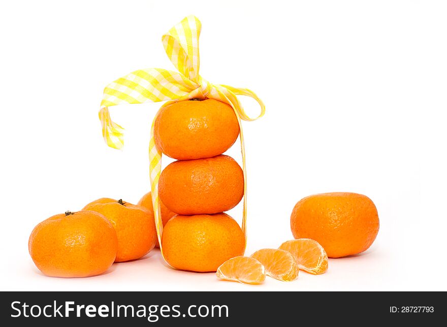 Tangerines and and slices on white background