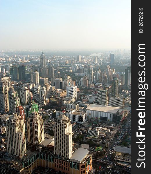 Urban view of Bangkoks modern skyline in daylight from above. Urban view of Bangkoks modern skyline in daylight from above