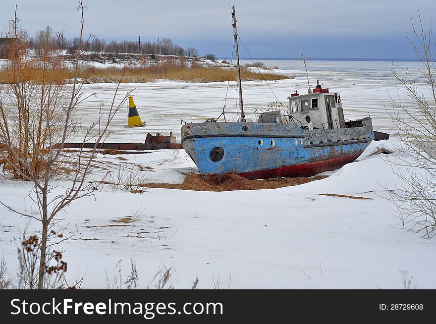 Winter landscape. Old ship.