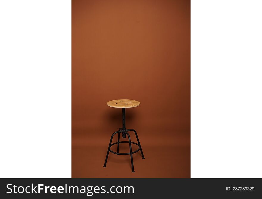 studio photography brown background and chair