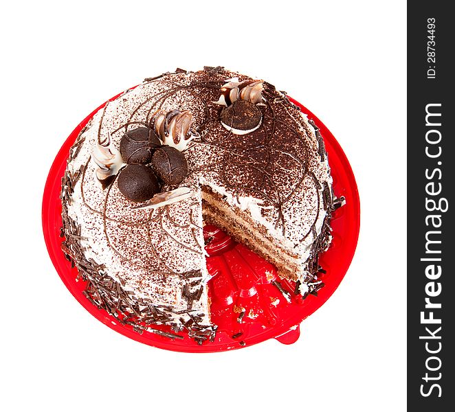 Cake chocolate on red plate on a white background
