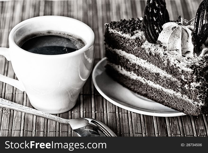 Black Coffee, A Slice Of Cake And A Teaspoon