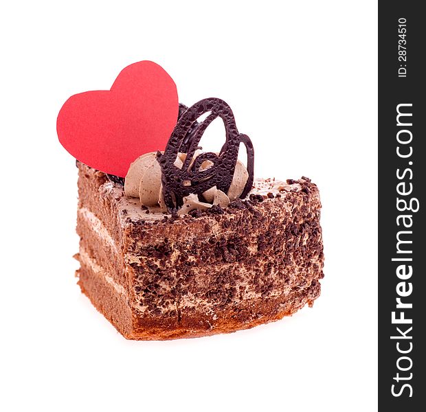 Heart on a piece of cake on a white background