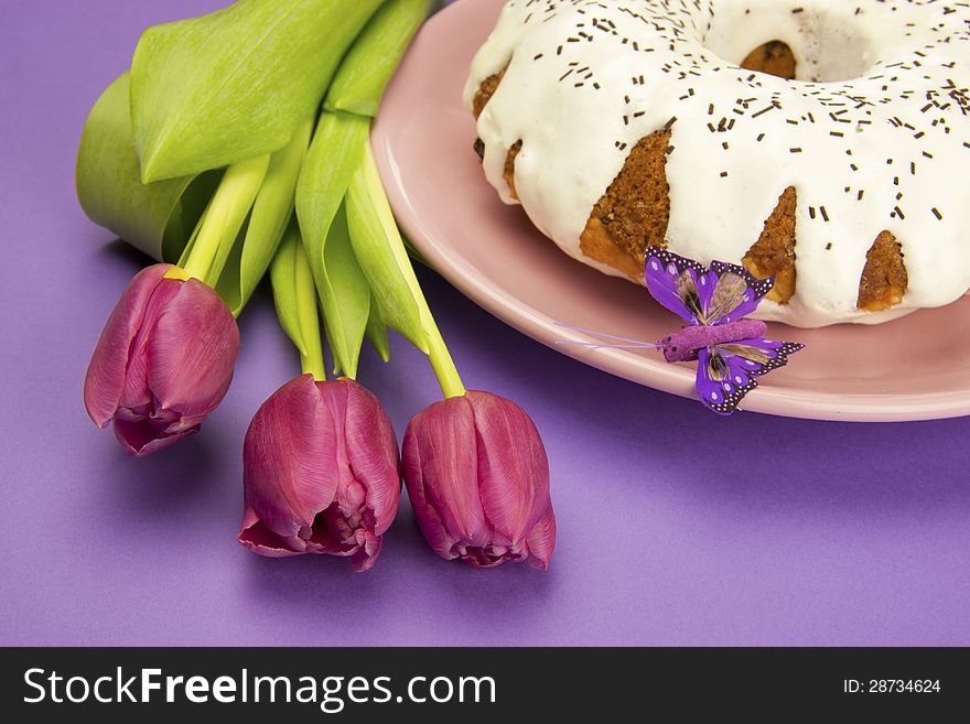 Easter composition with color tulips and cake. Easter composition with color tulips and cake