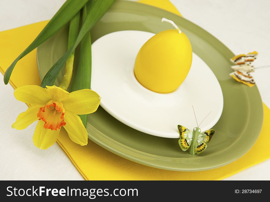 Easter composition with  plate for eggs and candle. Easter composition with  plate for eggs and candle