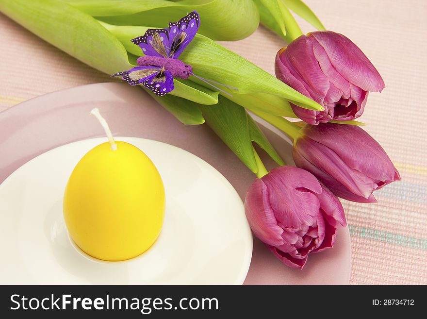 Easter composition with color tulips and candle. Easter composition with color tulips and candle