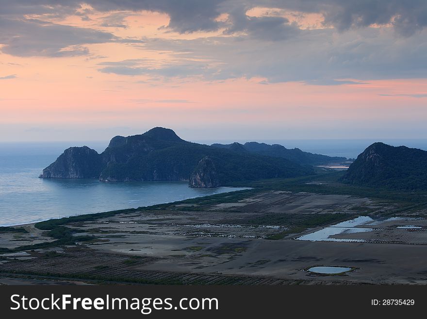Sunrise and mountain beside the sea at  khao sam roi yot national park, Thailand