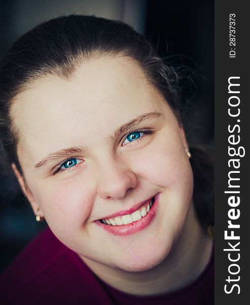 Close-Up Portrait Of A Happy Young Woman