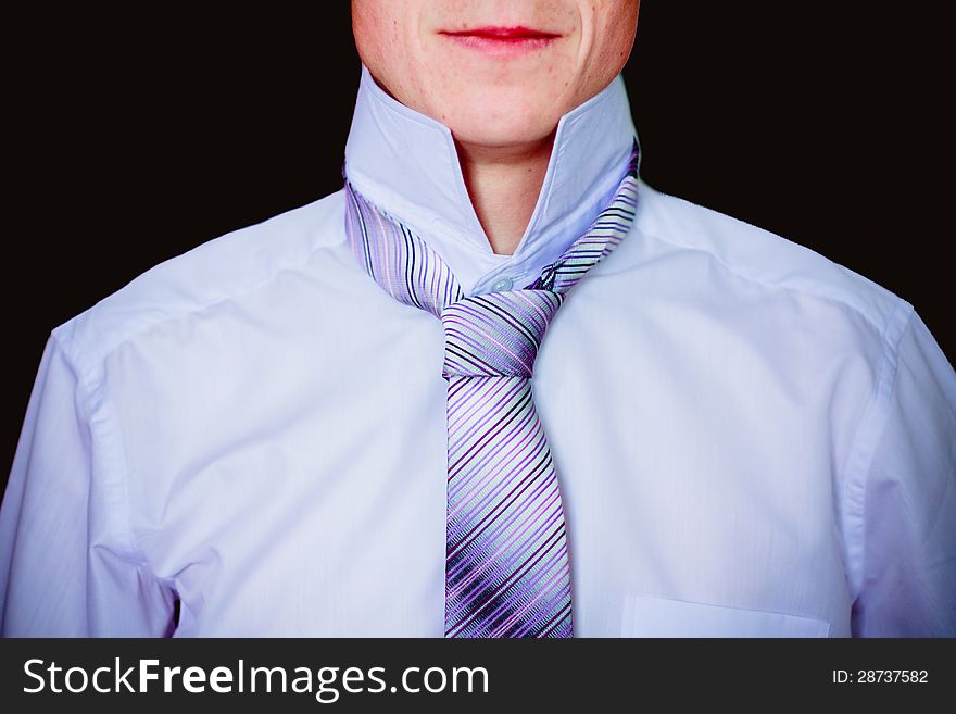 Closeup of business man tying a tie. Closeup of business man tying a tie