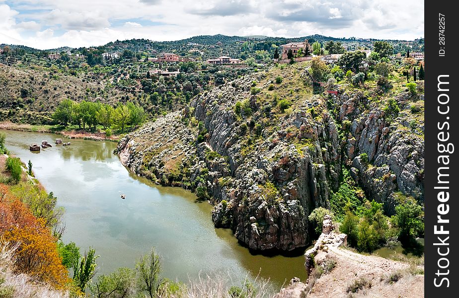 Typical castilian landscape and the Tagus River, the longest river on the Iberian Peninsula at 1,038 kilometers, begins its journey in the Albarracin mountains in Spain, and follows very constricted course for much of its length before reaching the Atlantic Ocean in Portugal. Seen here, it passes through the World Heritage listed city of Toledo. Typical castilian landscape and the Tagus River, the longest river on the Iberian Peninsula at 1,038 kilometers, begins its journey in the Albarracin mountains in Spain, and follows very constricted course for much of its length before reaching the Atlantic Ocean in Portugal. Seen here, it passes through the World Heritage listed city of Toledo.