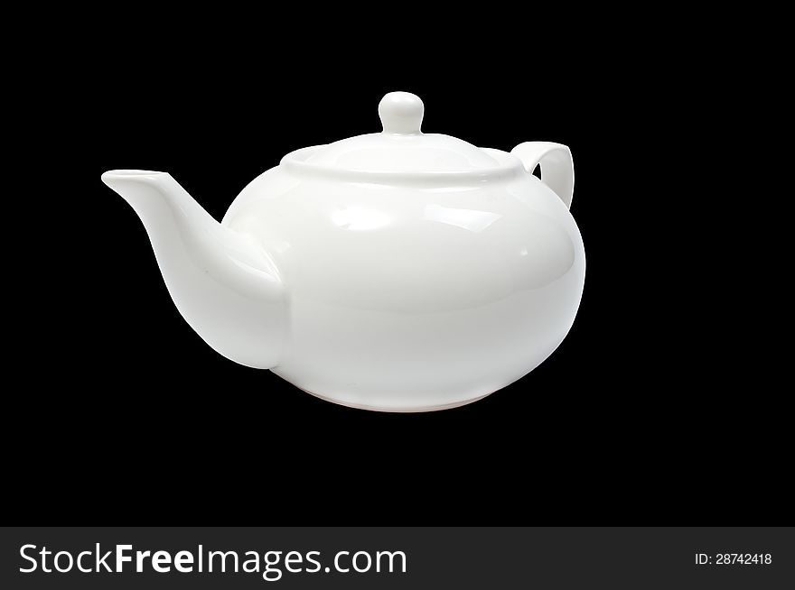 Tea pot isolated on black background
