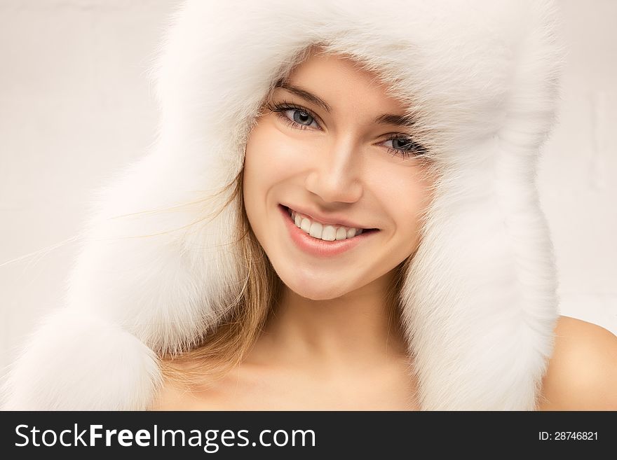 Fashion portrait of young beautiful woman posing on white background