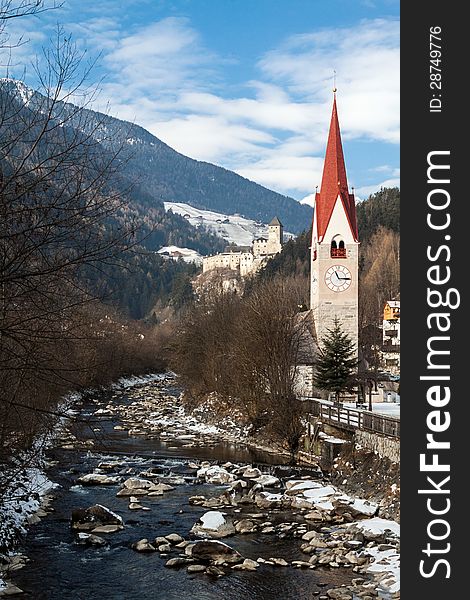 Church with a bell tower on the river Ahr, Campo Tures.