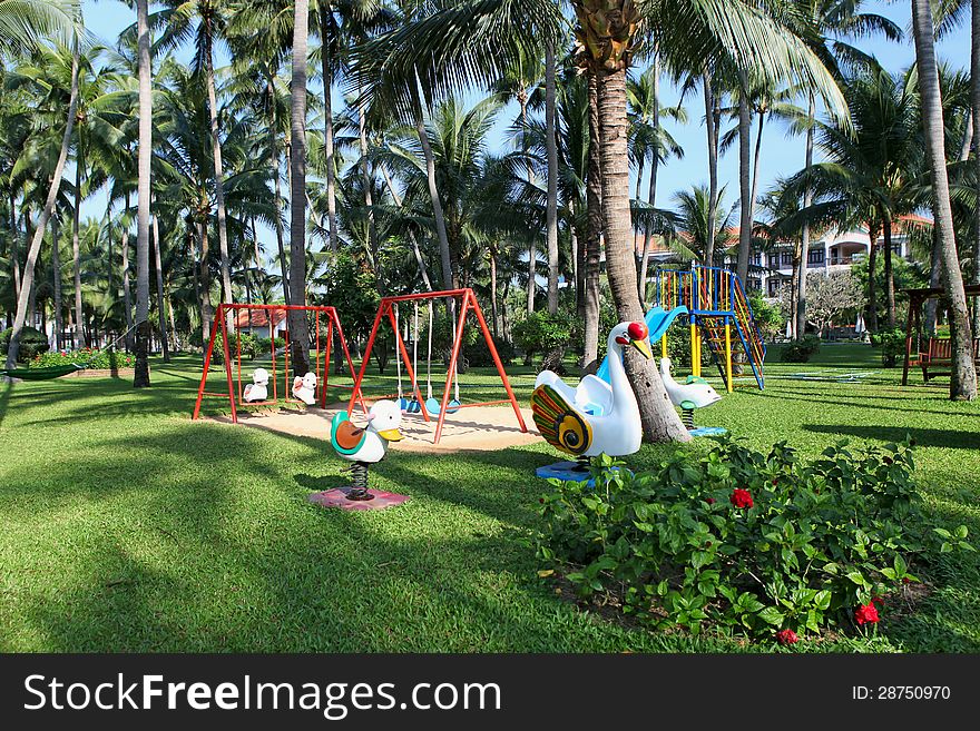 Children's playground at a beautiful park on a luxury tropical resort. Children's playground at a beautiful park on a luxury tropical resort