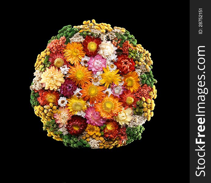 Colorful bouquet of dried flowers on a black background