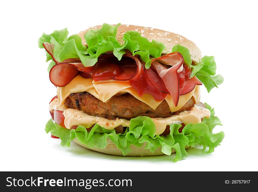 Delicious Hamburger with Bacon, Beef, Cheese, Tomato, Mayonnaise and Lettuce isolated on white background