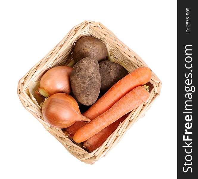 Basket with vegetables on a white background