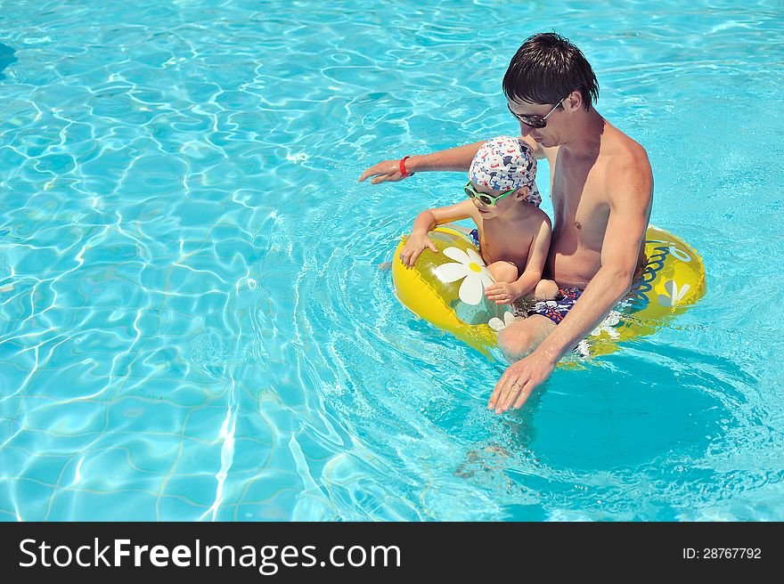 In the summer the father with the son have a rest on seacoast