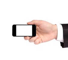 Hand Of A Businessman In A Suit Holding A Phone With Isolated Di Stock Image