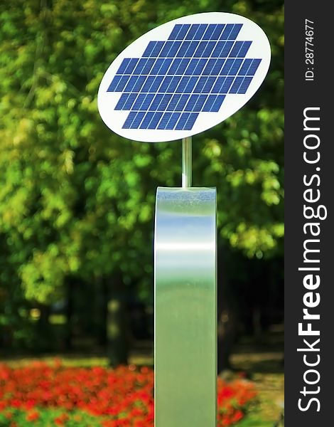 A photovoltaic Solar Panel with tree in the background. A photovoltaic Solar Panel with tree in the background.