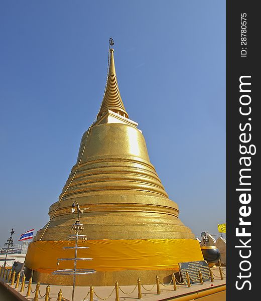 Golden pagoda on top of golden moutain in daylight. Golden pagoda on top of golden moutain in daylight