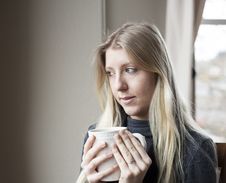 Young Woman Drinking Coffee Stock Images