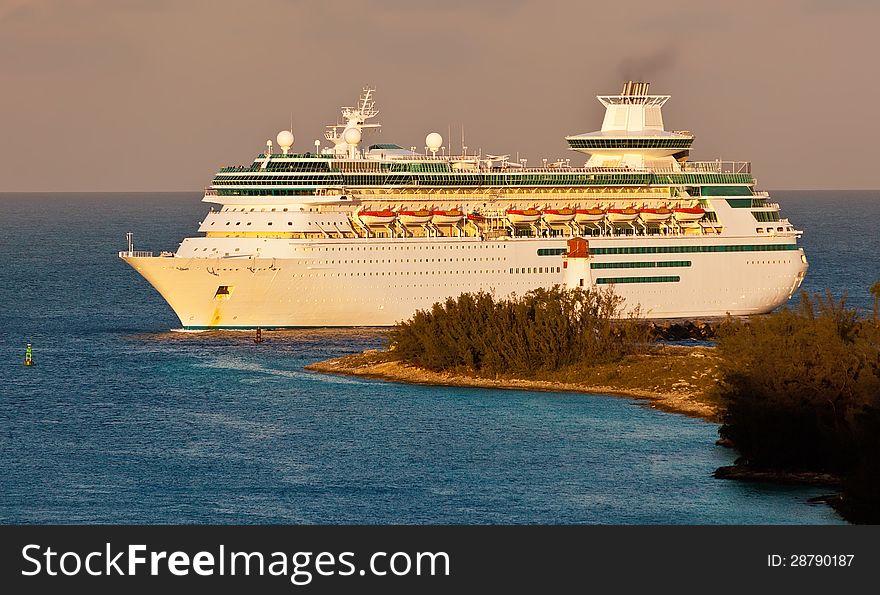 Cruise Ship entering harbor in Nassau, Bahamas at sunrise