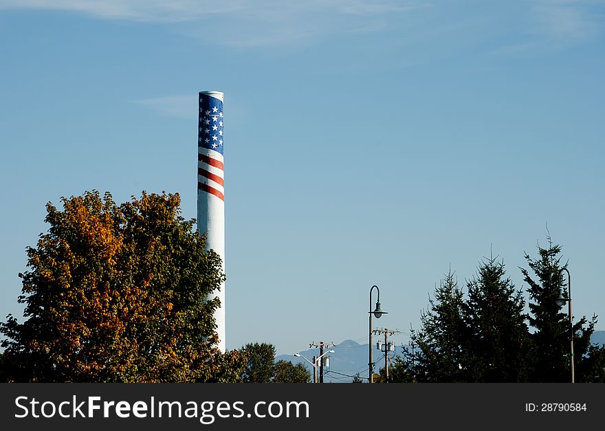 Tall smokestack with painted patriotic flag motif. Tall smokestack with painted patriotic flag motif