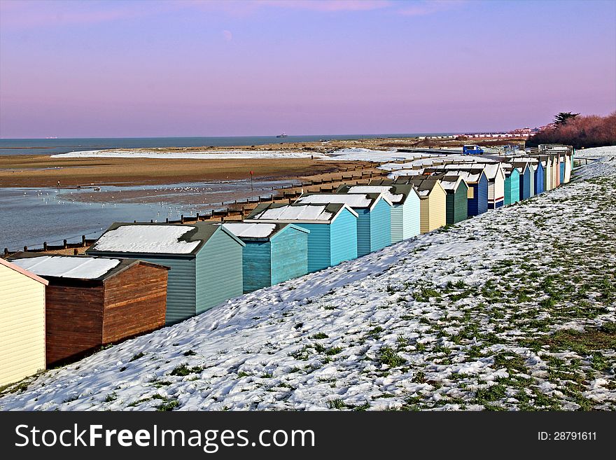 Photo of beach huts located along the coastline of whitstable in kent covered in winter snow. photo taken on 22nd January 2013. Photo of beach huts located along the coastline of whitstable in kent covered in winter snow. photo taken on 22nd January 2013.