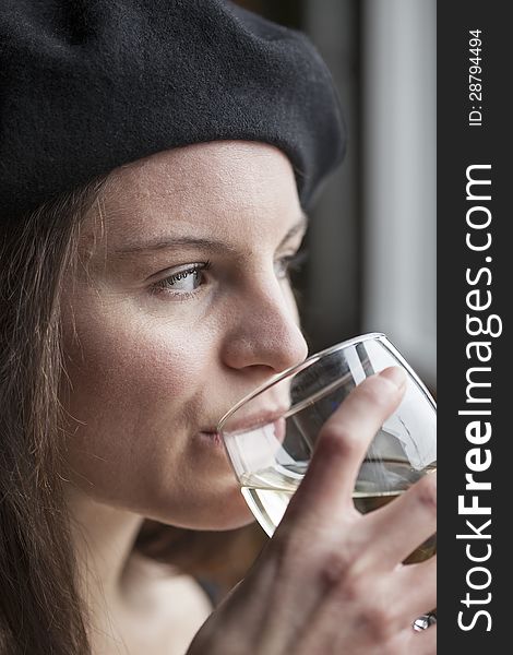 Portrait of a young woman with white wine. Portrait of a young woman with white wine.