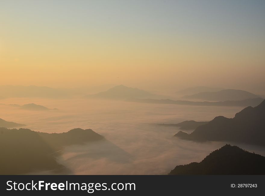 Mist before sunset between moutains