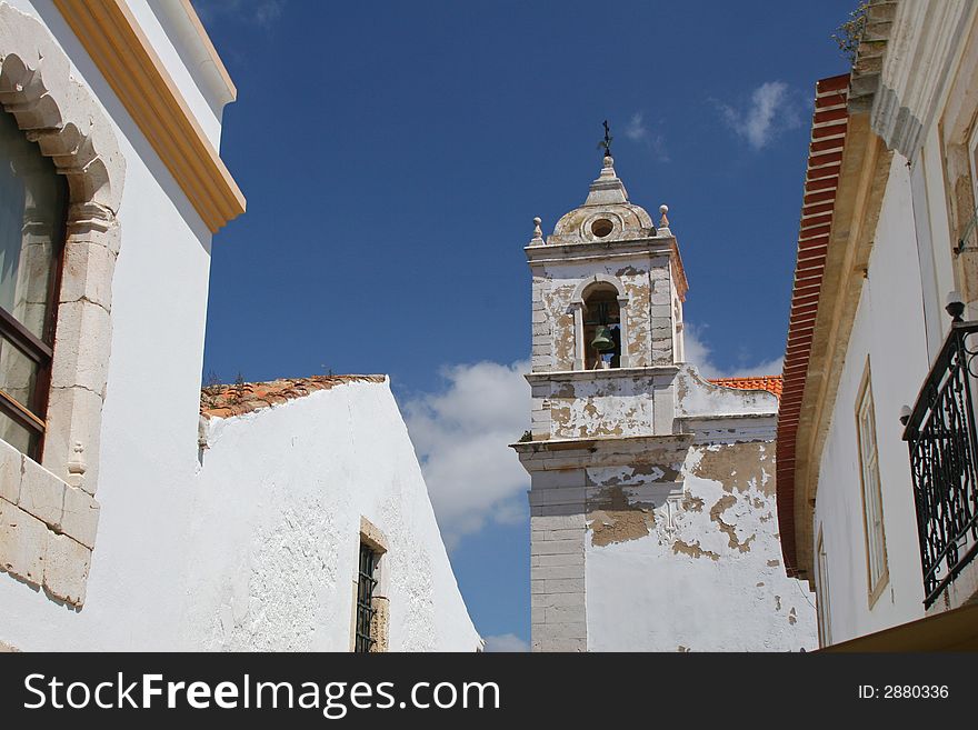 Old white church building with bell tower