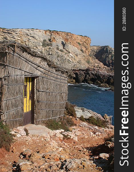 Old thatched fishermans beach shack